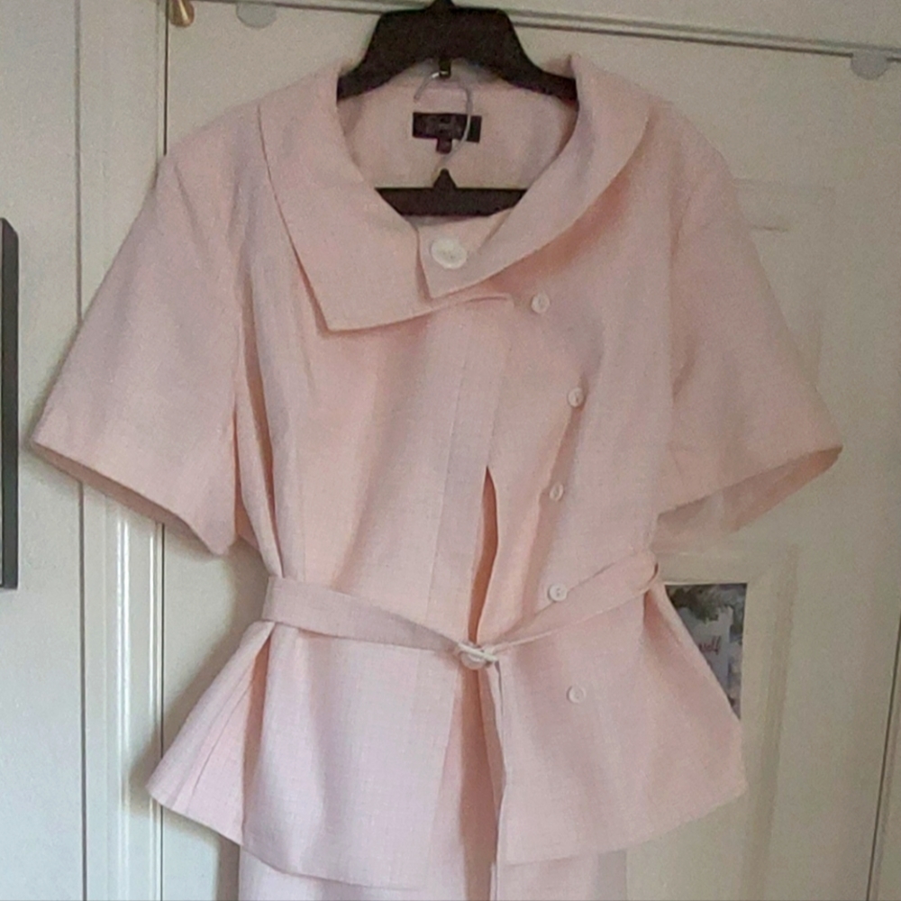 A  pink short sleeve jacket with skirt
